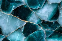 Cracked turquoise stone texture with golden veins creates dramatic natural pattern. Abstract mineral background shows luxurious crystalline structure and organic shapes.