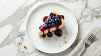 Elegant cheesecake slice topped with fresh blueberries and cranberry sauce on white plate, gourmet dessert presentation for restaurant menu design.