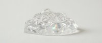 Clear crystal diamonds pile scattered on white background isolated for jewelry design and luxury concept projects.