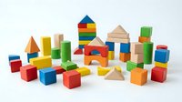 Colorful wooden building blocks set with geometric shapes including cubes, triangles and cylinders arranged on white background for educational play.