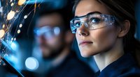 Young female scientist in protective eyewear examining glowing data visualization with bokeh lights. Male researcher works in background. Modern laboratory research.
