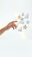 Female hand with bracelet releasing floating business and success icons including stars, charts, and spheres against white background for corporate growth concepts.