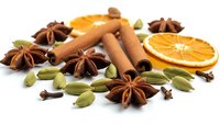 Aromatic spices and dried orange slices on white background. Cinnamon sticks, star anise, cardamom pods and cloves for cooking and baking recipes.