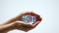Hand holding holographic digital sphere with glowing neon interface, futuristic technology concept for innovation, digital transformation, and next-generation solutions.
