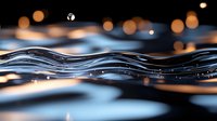Flowing liquid wave with golden bokeh lights creates dynamic motion against dark background, macro photography capturing water surface tension and light reflections.