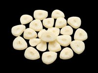 Dried white fig slices scattered in a pile, isolated on transparent background, ready for food packaging, stickers, print on demand, and T-shirt design use.