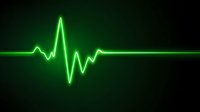 Glowing green heartbeat pulse line on dark background showing cardiac rhythm for medical or healthcare concept.