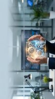 Businessman hands protecting glowing digital icons representing innovation, copyright, lightbulb ideas and security in modern office environment.