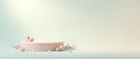 Pink cylindrical podium with white spheres and decorative elements on soft gradient background for product display and presentation.