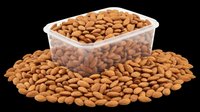 Roasted almonds in clear plastic container isolated on transparent background, ready for packaging design, labels, print-on-demand products, and culinary graphics.