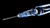 Medical syringe with needle on black background for healthcare, vaccination, injection, medicine and pharmaceutical concepts.