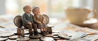 Elderly couple figurines sitting on coins with financial documents, representing retirement planning, pension savings, and senior financial security concepts.
