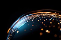 Glowing golden particles scattered across curved dark surface with blue highlights create magical atmosphere for festive backgrounds and luxury designs.