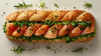 Fresh salmon sandwich on crusty baguette with lettuce, herbs and black pepper, arranged on white background for restaurant menu and food service.