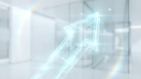 Glowing upward arrow symbolizing growth, success, and financial progress in modern corporate environment with blurred office background.
