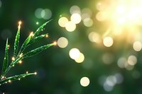 Fresh green leaves with morning dew drops sparkle in sunlight against blurred bokeh background, creating magical natural atmosphere for nature and wellness designs.