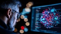 Caucasian male scientist analyzing molecular structure on computer screen with glowing virus visualization in blue and red colors against dark background.