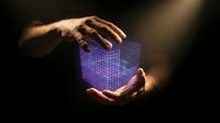 Hands holding glowing purple digital cube with grid pattern against dark background, representing technology, data, innovation, and digital transformation for business concepts.