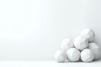White geometric spheres with faceted polygonal surface stacked in pyramid shape against clean white background, minimalist modern design composition.