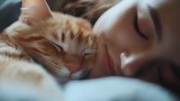 Young Asian woman sleeping peacefully next to ginger cat on white bedding, soft morning light creating dreamy atmosphere, wellness and pet companionship concept.