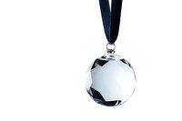 Crystal glass award medal with black ribbon on white background, isolated object for business achievement and recognition designs.