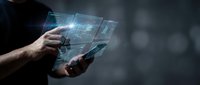Businessman using smartphone with holographic digital interface displaying data analytics and futuristic technology concepts for mobile business applications.