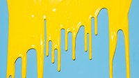 Dripping yellow paint flows down blue vertical stripes with sparkles, creating a modern graphic design suitable for backgrounds, web design, and creative projects.