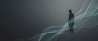 Silhouette of a man standing amid flowing, translucent waves of light and energy against a dark background, representing innovation, transformation, and forward momentum in business and technology concepts.
