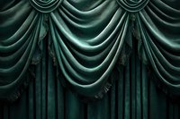 Luxurious emerald green velvet curtains with classic Austrian drape style and decorative trim create elegant theatrical backdrop for stage or interior design.