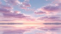Serene lake at sunset with pink and purple clouds reflecting on calm water surface creating mirror effect and peaceful atmosphere.