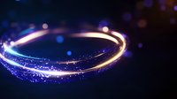 Glowing spiral light trail with sparkling particles against dark background creates magical atmosphere, blue and gold luminous effect for festive designs.