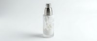 Transparent spray bottle with white liquid and metal pump dispenser isolated on white background, ready for cosmetic, skincare, or cleaning product packaging design and branding mockups.