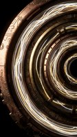 Glowing energy vortex swirling through a bronze steampunk portal with concentric rings and circuit engravings on dark background.