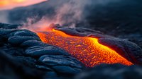 Glowing hot lava flow with molten magma breaking through dark volcanic rock surface during eruption, dramatic orange and red colors against black basalt.