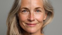 Senior woman with silver hair and natural smile against neutral background, showing aging gracefully with confidence and wisdom.
