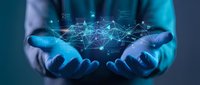 Hands holding a glowing digital network with connected nodes and data icons, representing technology, connectivity, and innovation in business.