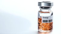 Medical vial labeled Energy containing orange granular substance with barcode on white background for pharmaceutical and healthcare concepts.