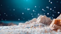 Macro shot of pink Himalayan salt crystals on dark turquoise background with bokeh light effects, showing mineral texture and crystalline structure.