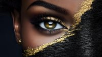 Close up of brown eye with gold glitter makeup and dark skin. Artistic beauty portrait featuring dramatic eye shadow, metallic accents and flawless cosmetic application.