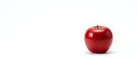 Fresh red apple isolated on white background for healthy eating and nutrition concepts.