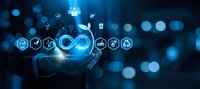 Business professional presenting digital technology icons with infinity symbol representing endless innovation and connectivity solutions.