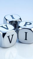 Metallic silver dice with letters spelling VIP on white background for luxury business and exclusive membership concepts.