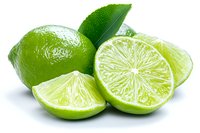 Fresh lime fruits with water drops, whole and cut in half showing juicy pulp segments on white background, for food and beverage designs.