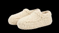 Pair of cream knitted slippers with textured knit pattern, isolated on transparent background. Ready for t-shirt design, clipart, stickers, print-on-demand products, and sublimation projects.