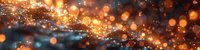 Magical glowing orange and gold bokeh lights with sparkles on dark background create dreamy atmospheric effect. Abstract festive holiday backdrop.