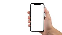 Hand holding modern smartphone with blank white screen isolated on white background for mockup and app presentation purposes.