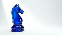Vibrant blue glass chess knight piece isolated on white background, ready for design projects, game graphics, and strategic business concepts.