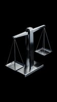 Modern silver balance scale with glass plates on black background representing justice, law, equality and fair judgment in legal system.