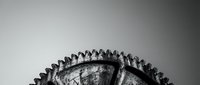 Close-up of worn bicycle tire tread pattern showing detailed rubber texture and grip design in monochrome photography for cycling maintenance concepts.