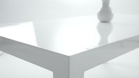 Modern white glossy table corner with minimalist design and clean reflective surface for contemporary interior decoration and furniture concepts.